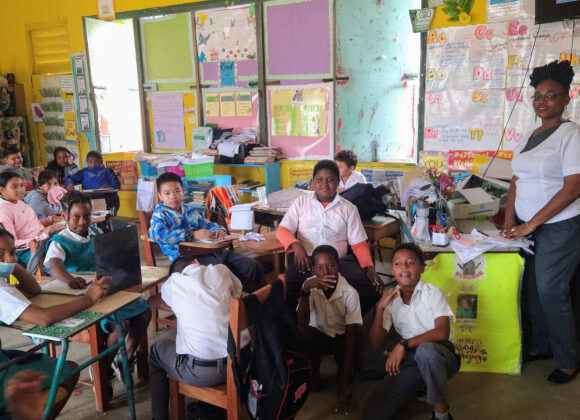 A teacher and her pupils in a Belizean primary school classroom