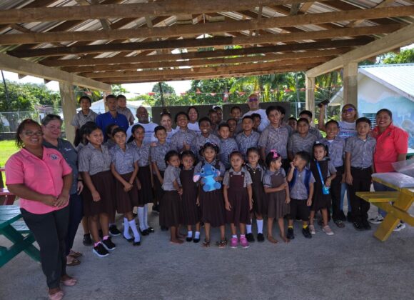 Pupils and teachers gathered for a Build Belize handover at Forest Home Methodist School